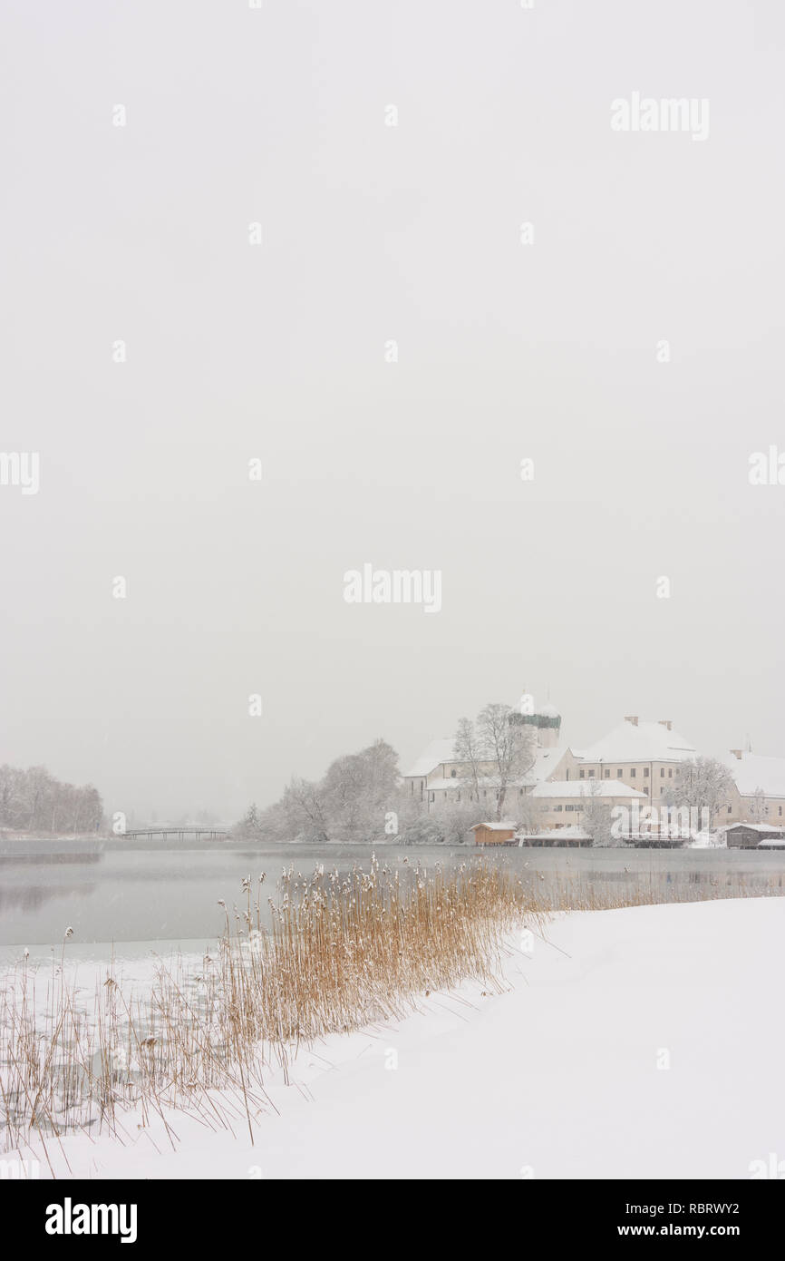 Seeon-Seebruck: Seeon Abbey, lake Klostersee, church Sankt Lambert, snow in Oberbayern, Chiemsee Alpenland, Upper Bavaria, Bayern, Bavaria, Germany Stock Photo