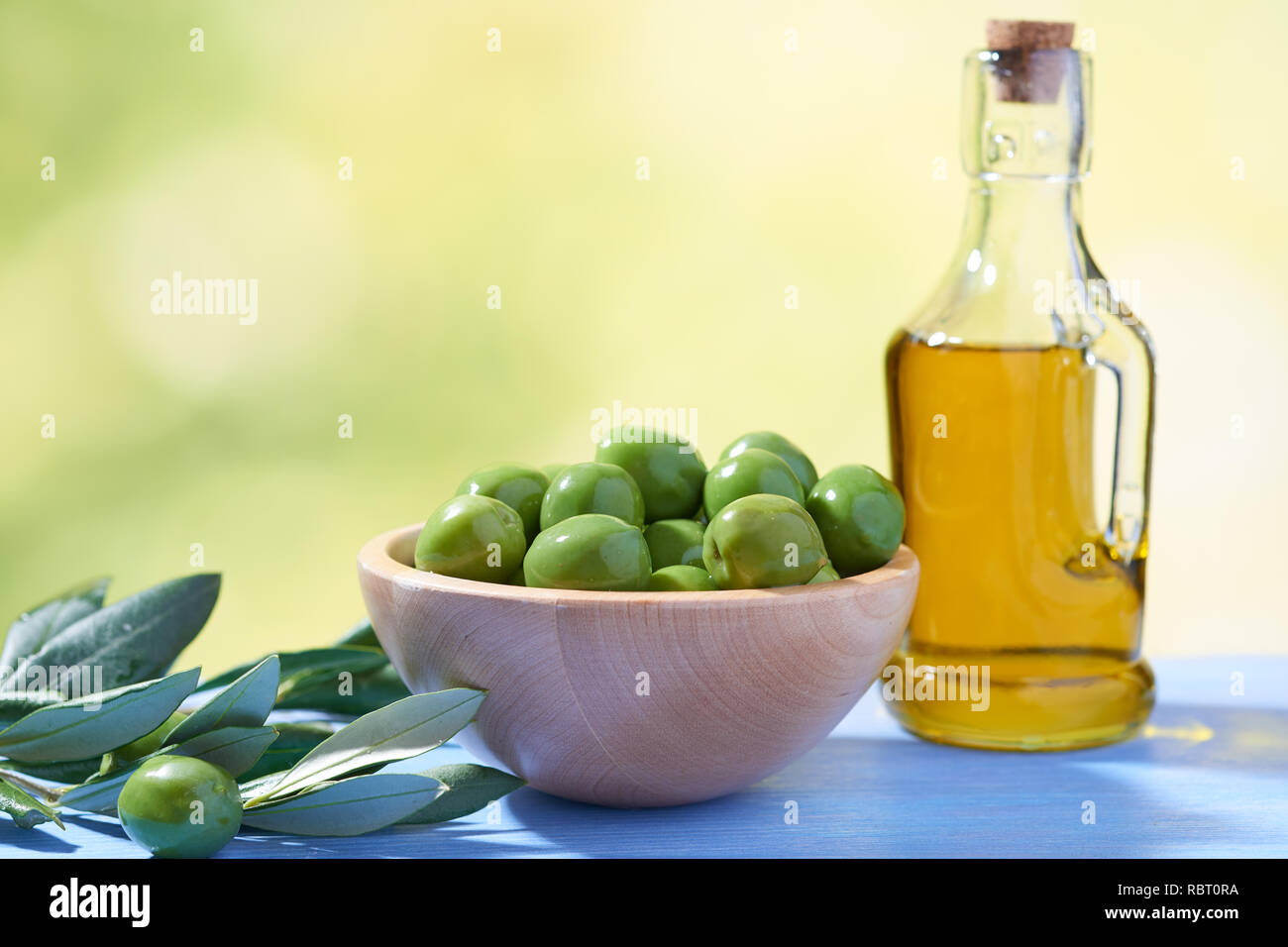 Green olives and olive oil Stock Photo - Alamy