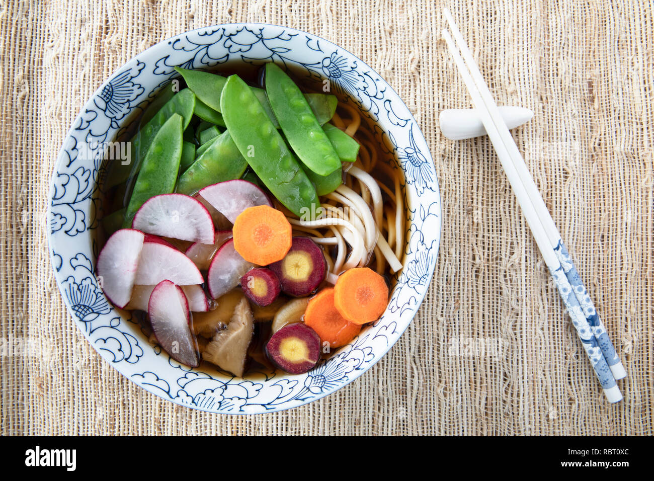 Filling bowl with udon noodle soup series image seven bowl with