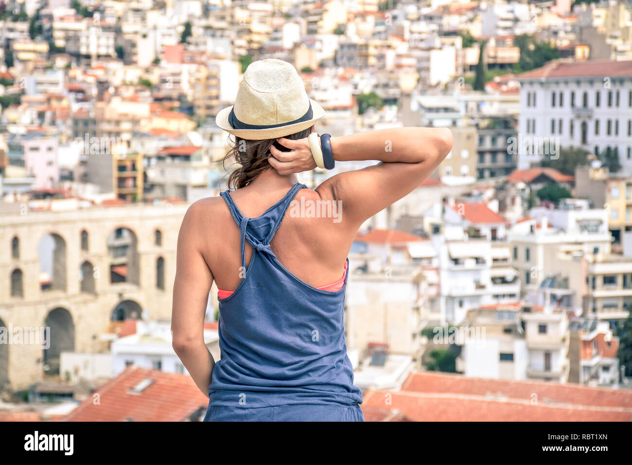 Girl with a hat on the roof Stock Photo