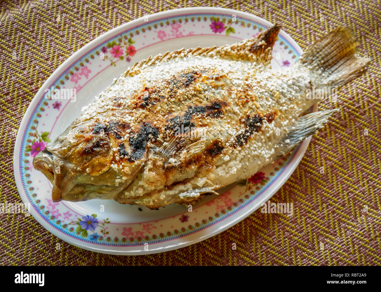 Grilled fish tilapia Cook tilapia with Salt in asian style food on