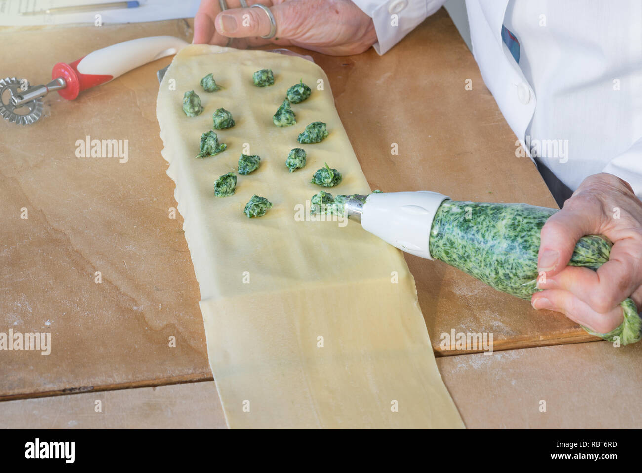 Italian pasta, preparation of tortelli with spinach and ricotta Stock Photo
