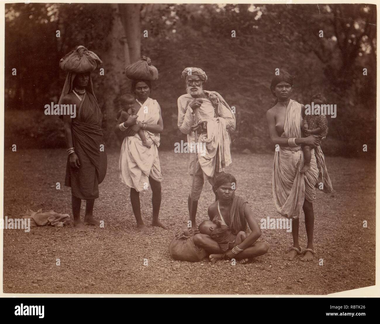 -Old Man and Women with Children, One Nursing Stock Photo - Alamy