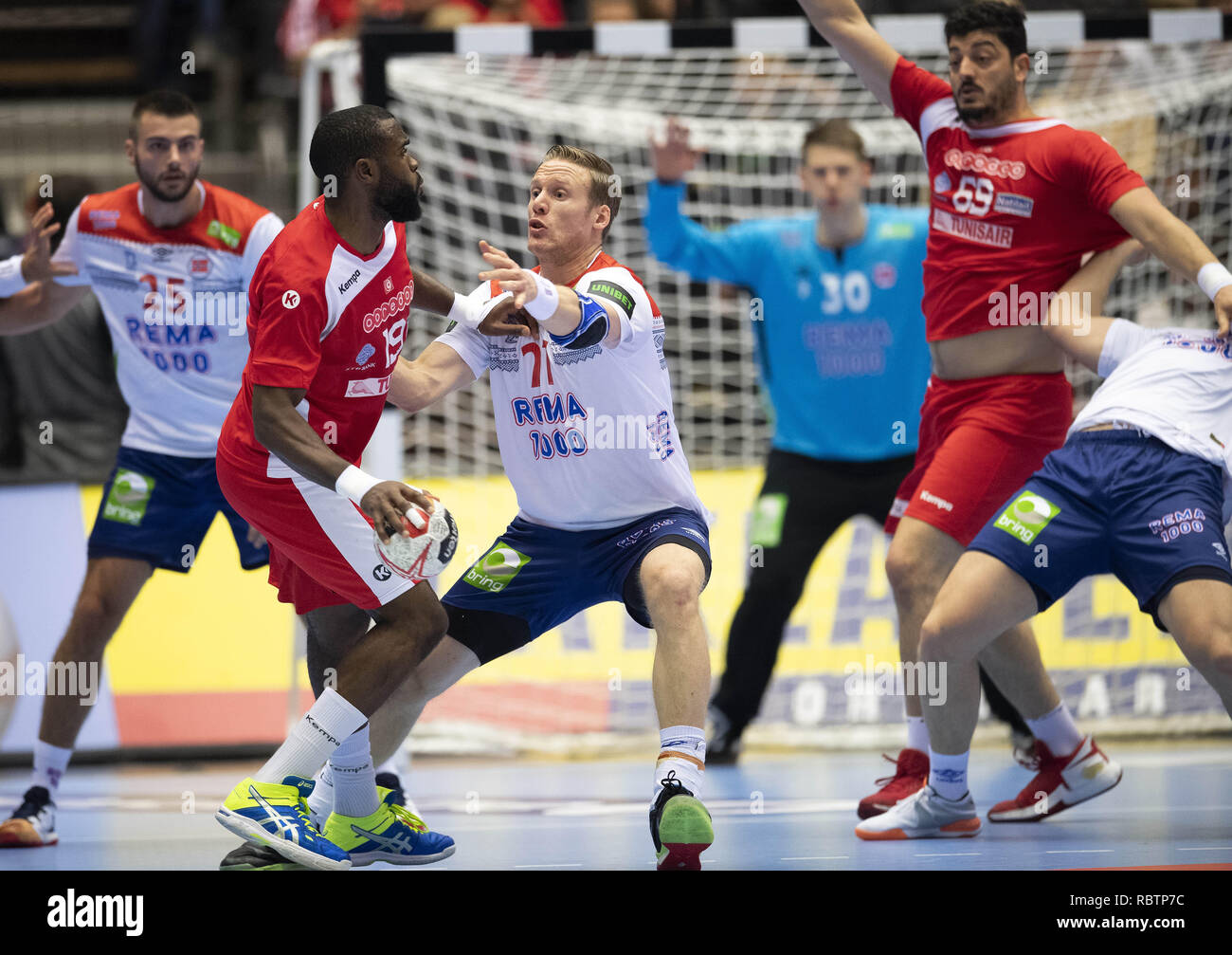 Herning, Denmark. 11th Jan, 2019. Mosbah Sanai (19), Tunisia and Magnus Gullerud (21), Norway are fighting for the ball in the group C handball match between Tunisia and Norway in Jyske Bank Boxen in Herning during the 2019 IHF Handball World Championship in Germany/Denmark. Credit: Lars Moeller/ZUMA Wire/Alamy Live News Stock Photo