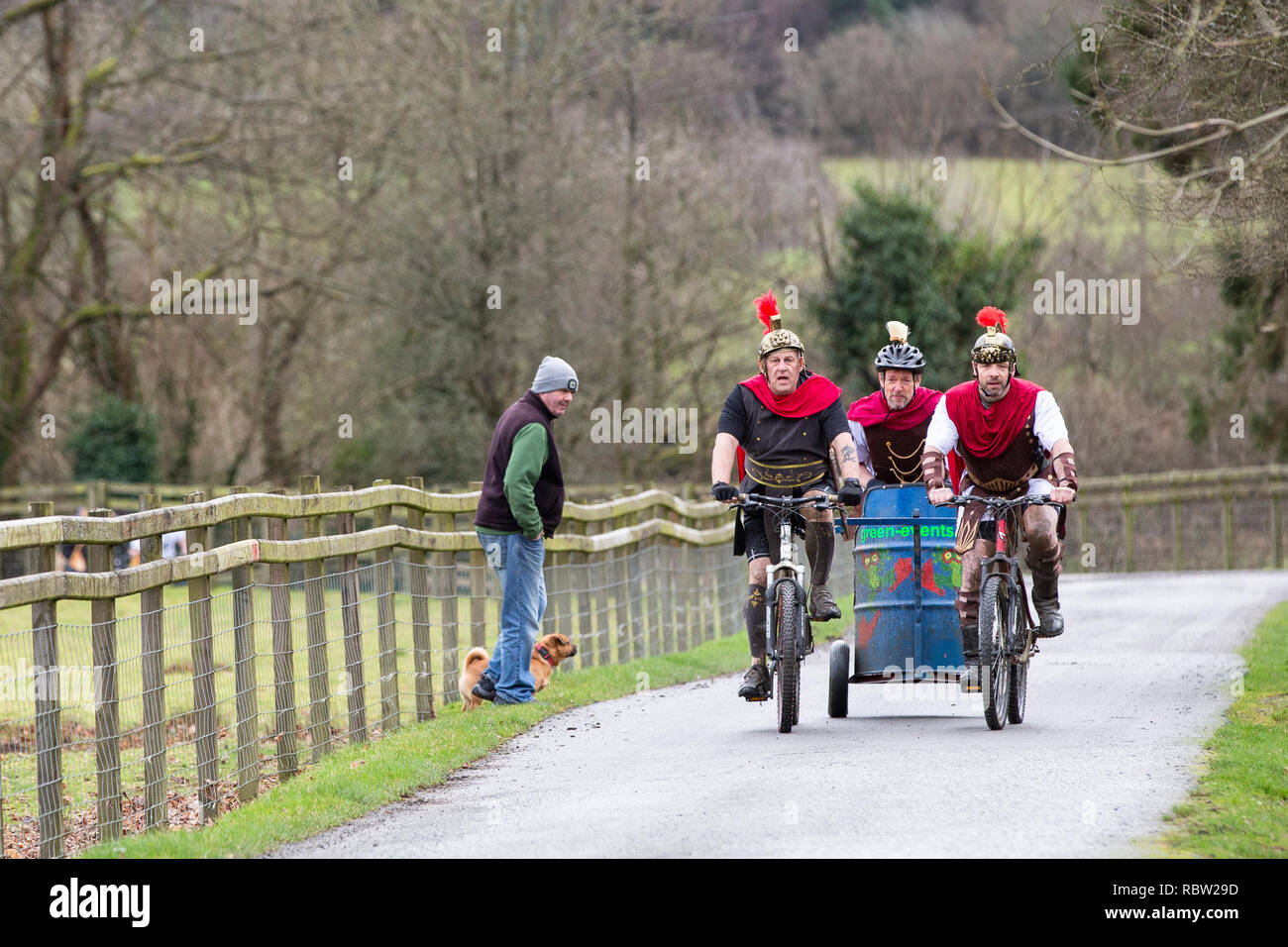 Competitors race mountain bike chariots in the annual Llanwrtyd Wells World Mountain Bike Chariot Race in Powys, Wales. Stock Photo