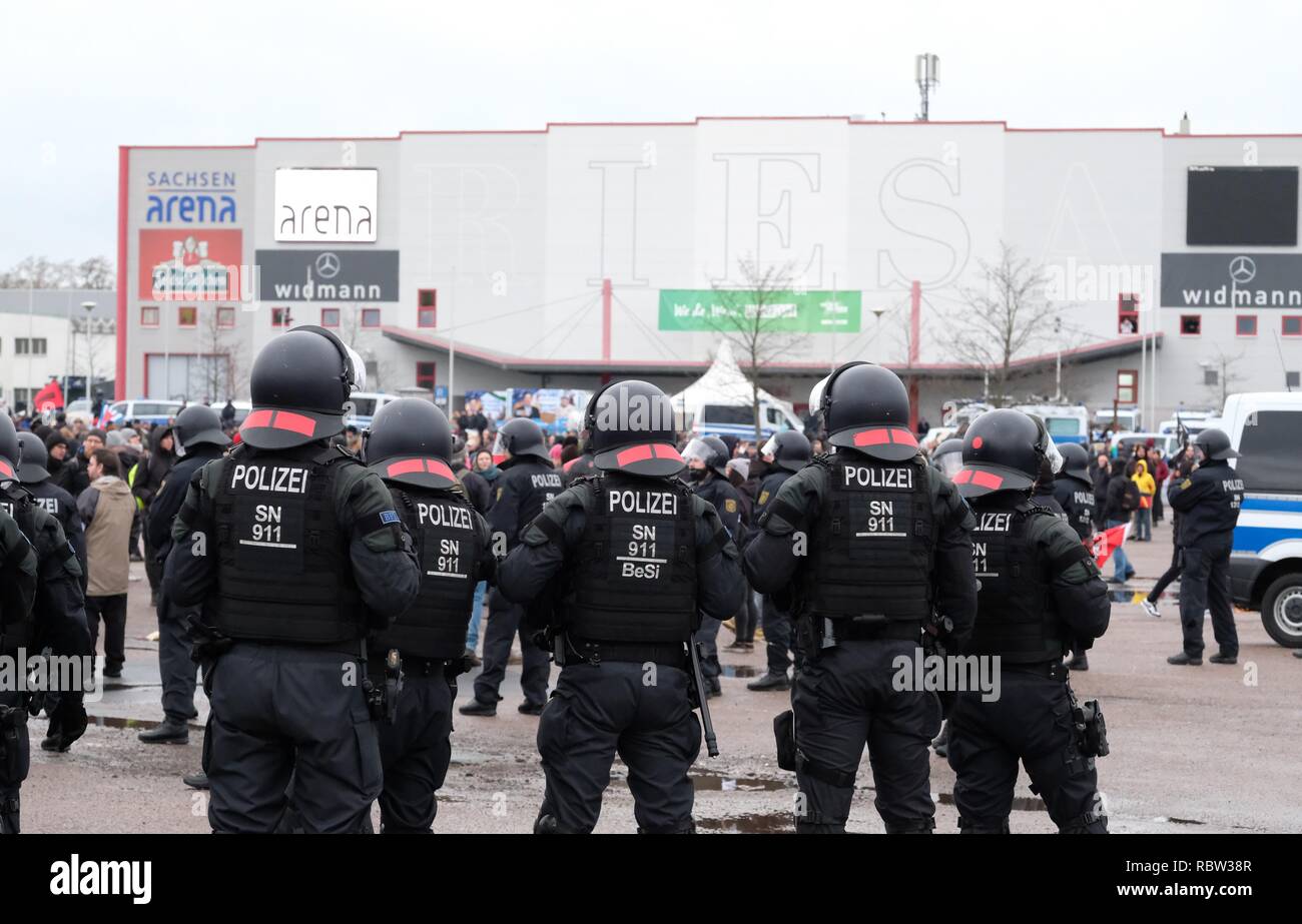 Riesa, Germany. 12th Jan, 2019. Police are standing on the edge of a demonstration in front of the Saxony-Arena. The demonstrators protest against the federal party conference of the AfD, which is being held there at the same time. Until 14.01.2019 AfD delegates elect their candidate for the European elections in 2019. Credit: Sebastian Willnow/dpa-Zentralbild/dpa/Alamy Live News Stock Photo