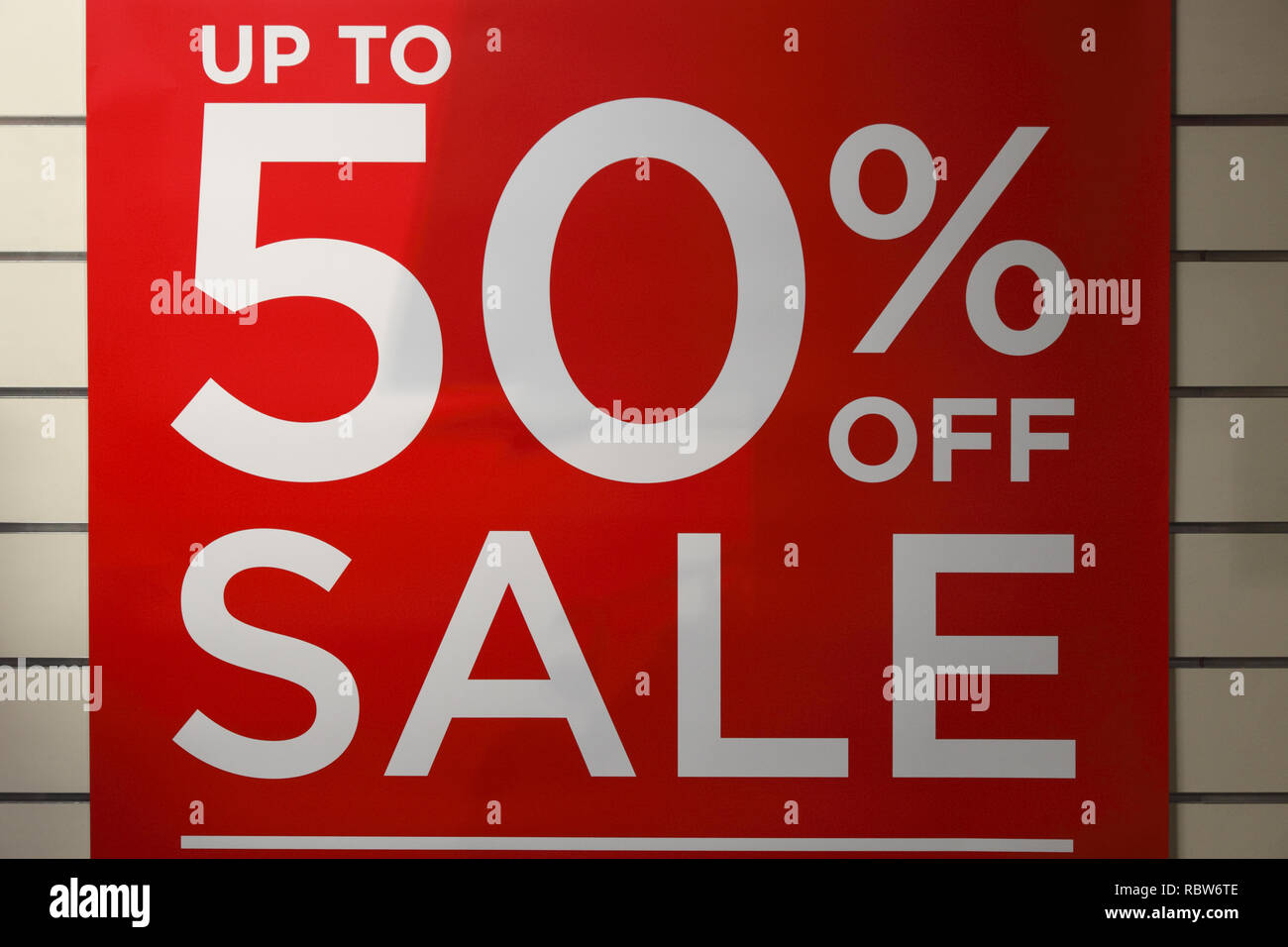 up to 50% sale off sign in a clothing store in the UK Stock Photo - Alamy