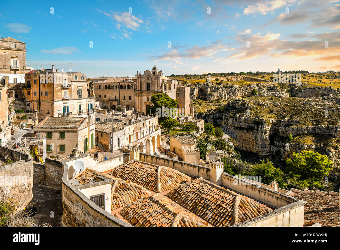 The Convent of Saint Agostino overlooks the canyon and the ancient sassi caves in the city of Matera, Italy. Stock Photo