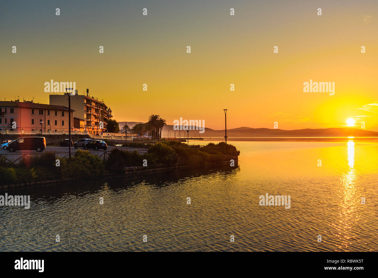 View of Orbetello in lagoon on peninsula Argentario at sunrise. Tuscany ...