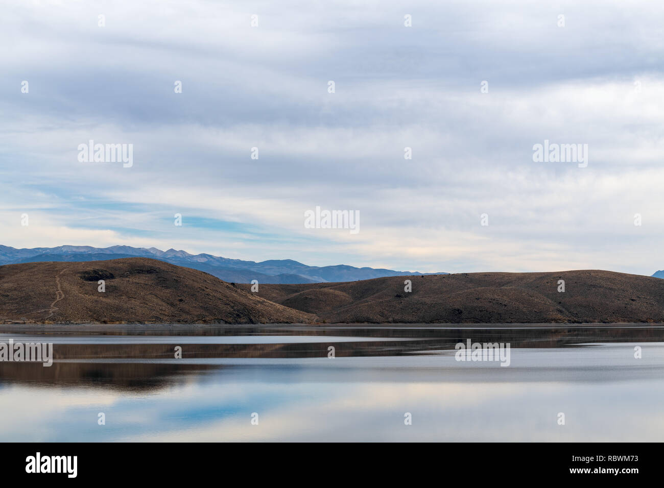 Mountains and sky reflected in Topaz Lake on the Nevada California border, USA Stock Photo