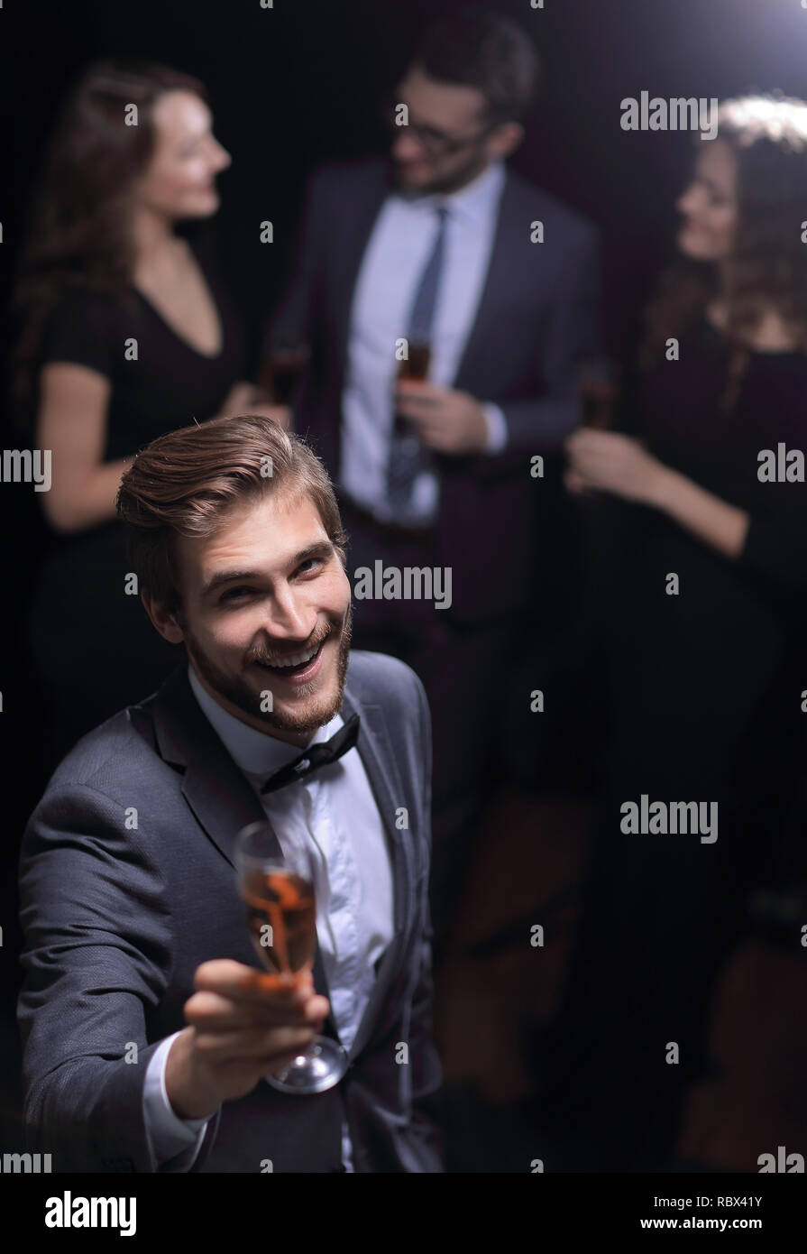 Hand raising a glass hi-res stock photography and images - Alamy