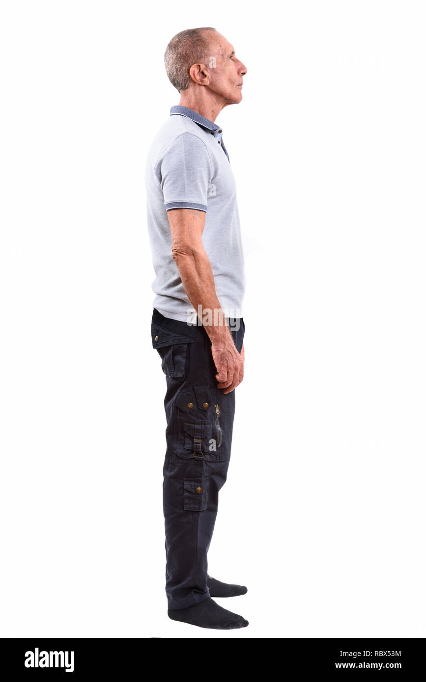 Profile view of full body shot of senior man standing Stock Photo