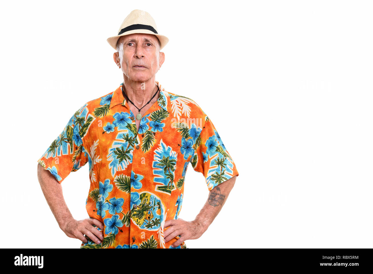 Studio shot of senior man with hands on hips Stock Photo