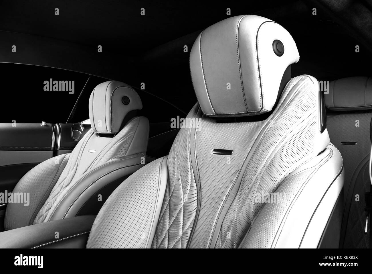 Modern Luxury car inside. Interior of prestige modern car. Comfortable leather seats. Perforated