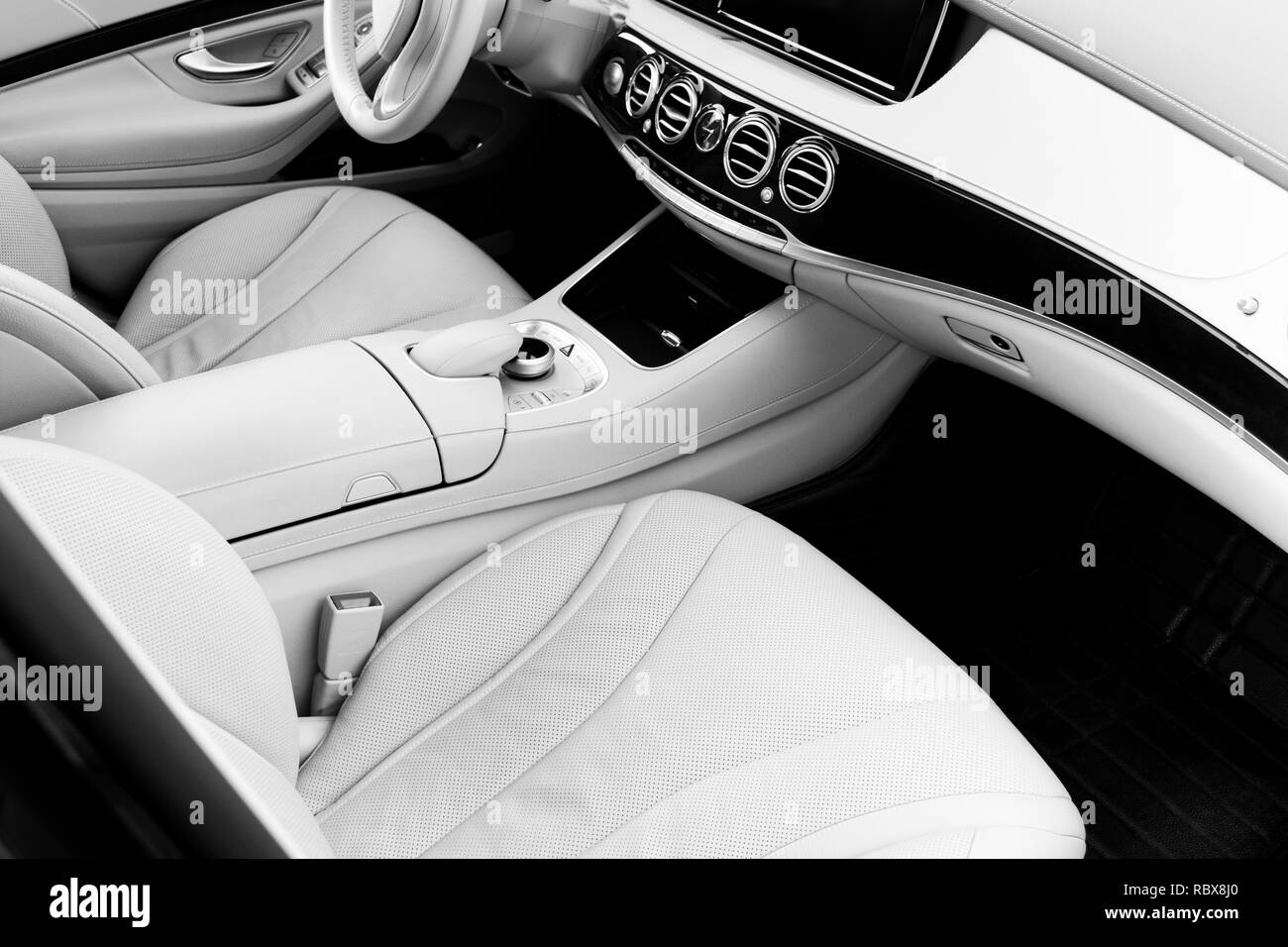 White leather interior of the luxury modern car. Leather comfortable