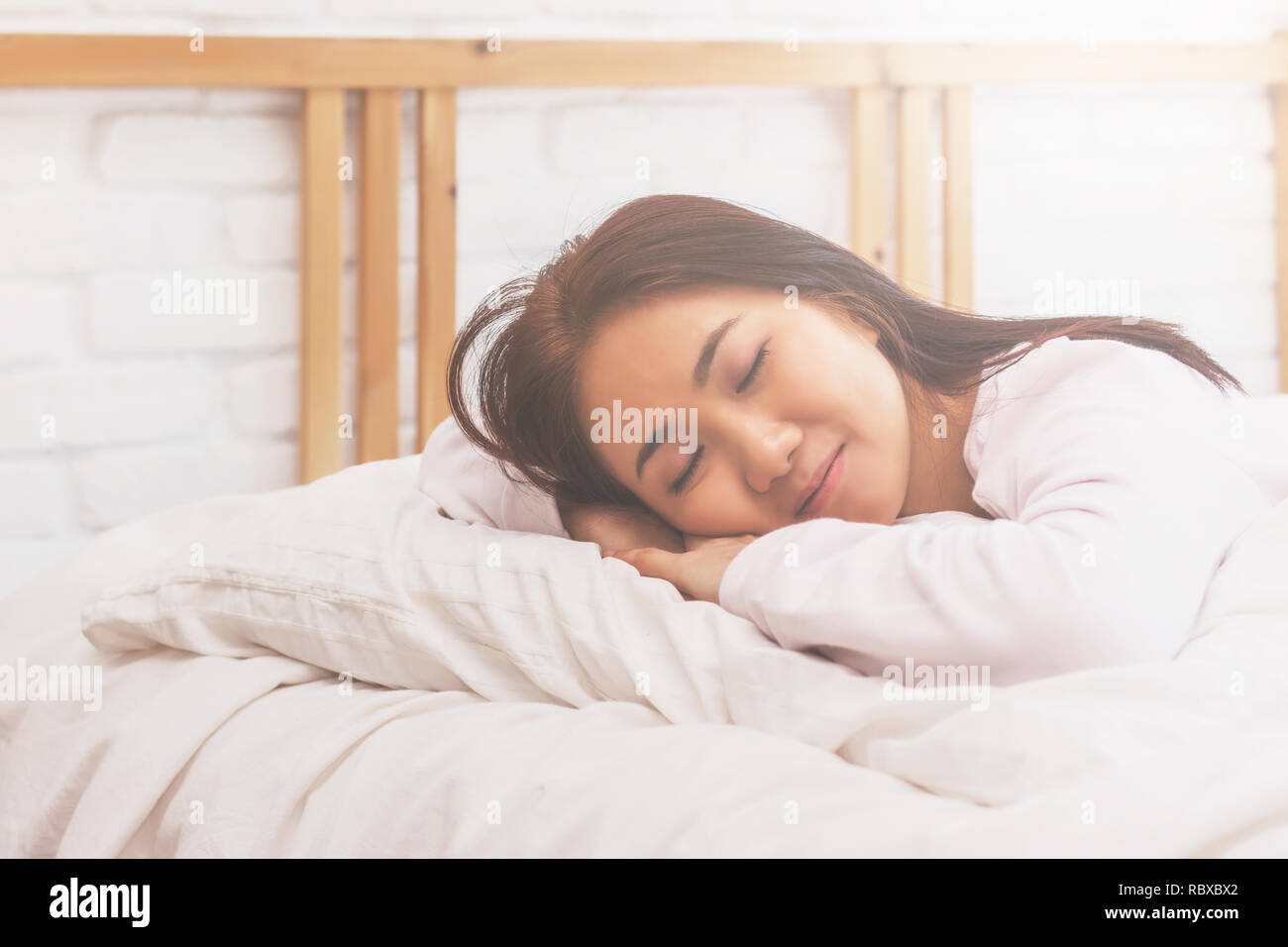 Asian Woman Sleep On White Pillow On Bed In Bedroom In Holiday