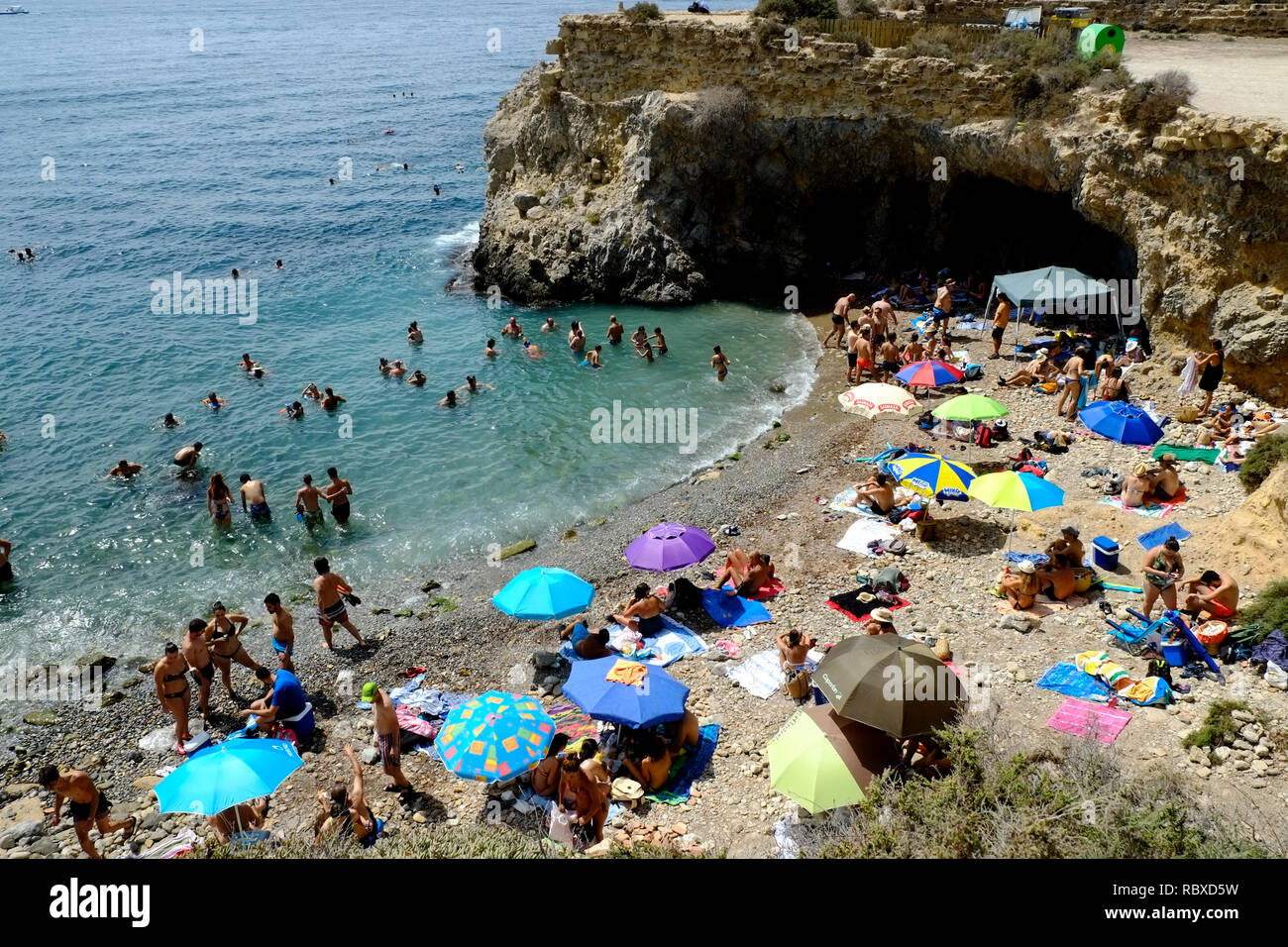 View of a crowded beach cove on the island of Tabarca, Alicante. Spain Stock Photo