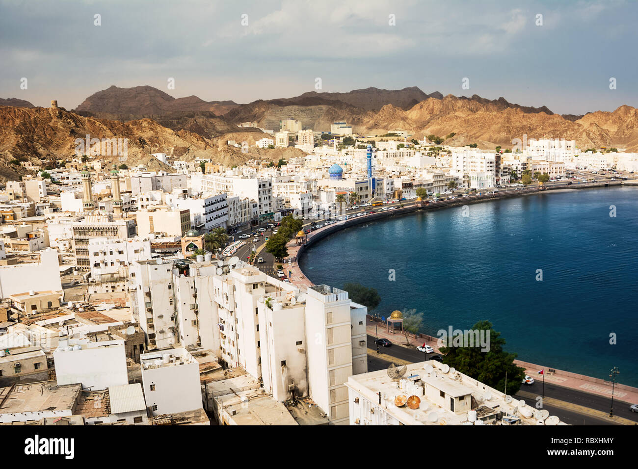 Mutrah waterfront with Mosque in Muscat at sunset and Corniche with nobody Stock Photo