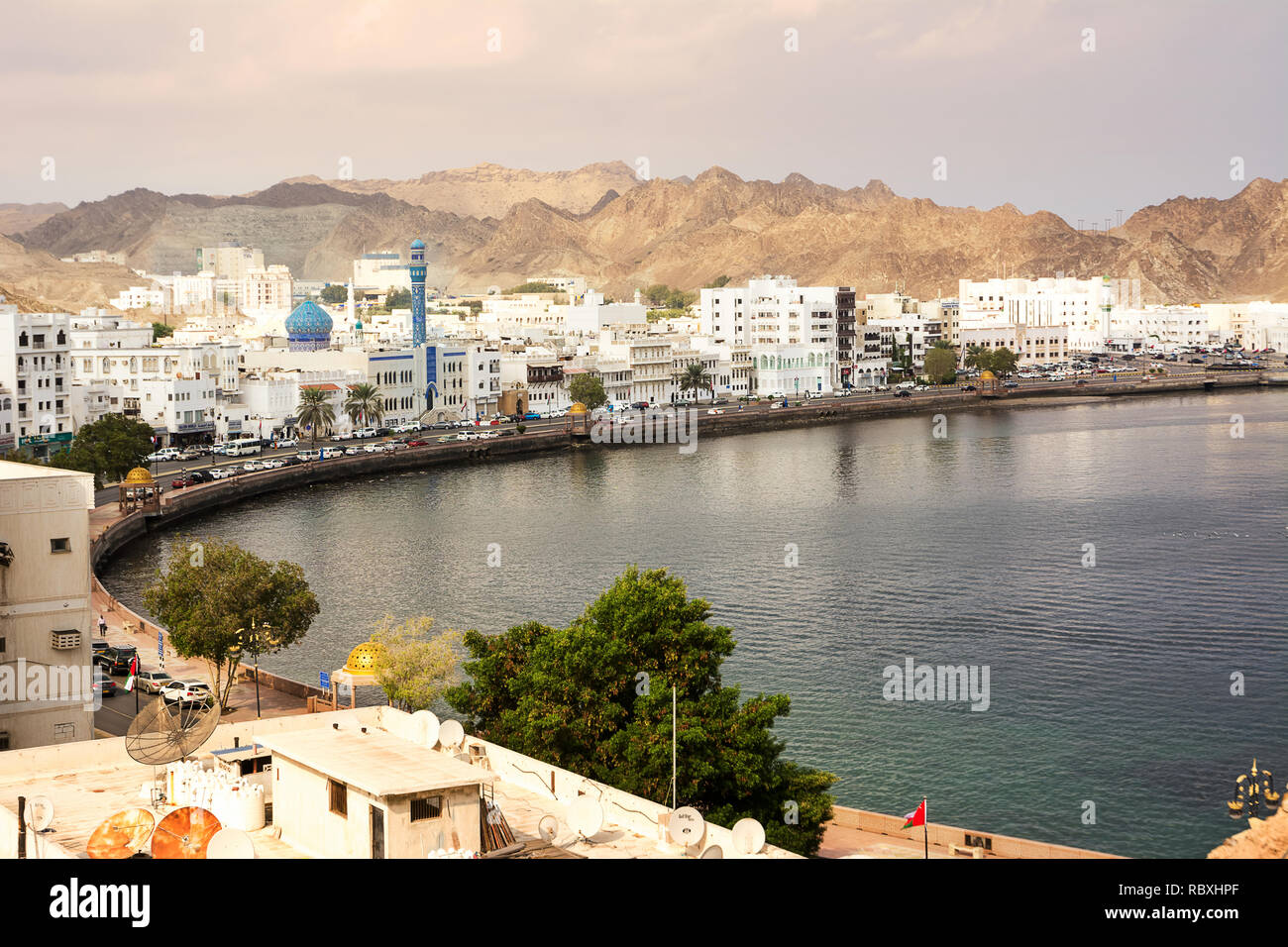 Muscat, Oman - November 1, 2018: Mutrah waterfront with Mosque in Muscat at sunset and Corniche with nobody Stock Photo