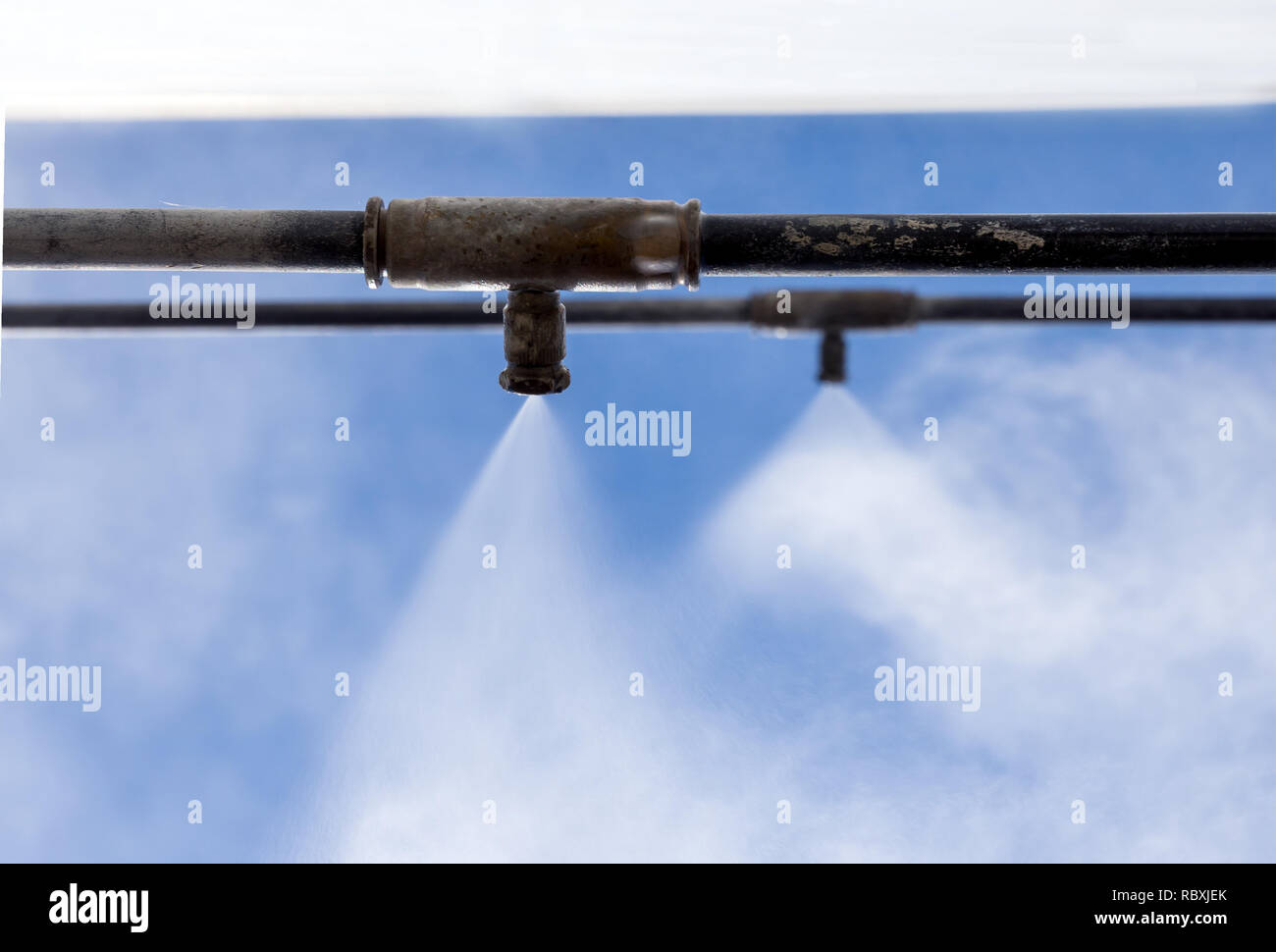The work of the new cooling system with water mist Stock Photo Alamy