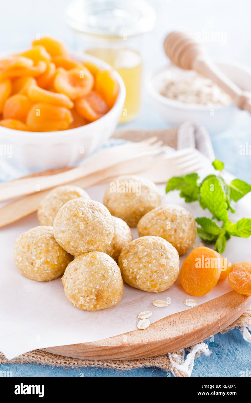 Oat balls with honey, apricot and banana, healthy vegan dessert Stock Photo