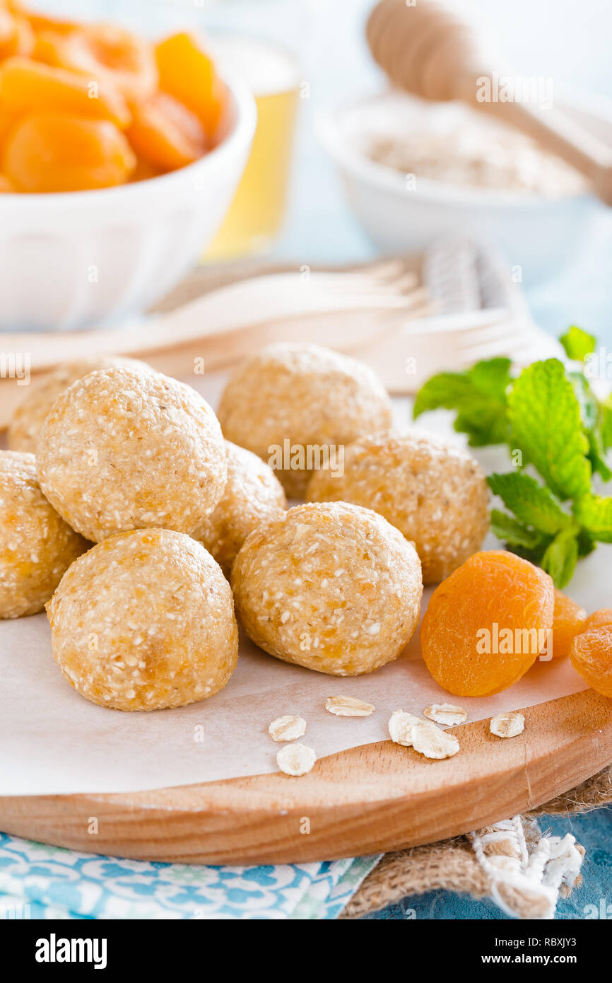 Oat balls with honey, apricot and banana, healthy vegan dessert Stock Photo