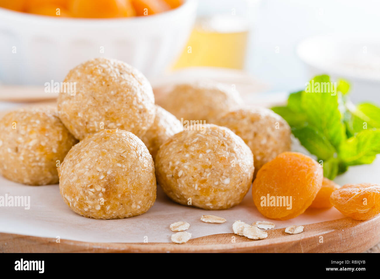 Oat balls with honey, apricot and banana, healthy vegan dessert Stock Photo
