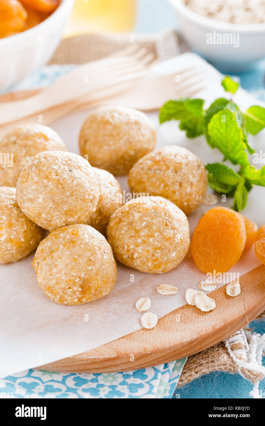 Oat balls with honey, apricot and banana, healthy vegan dessert Stock Photo