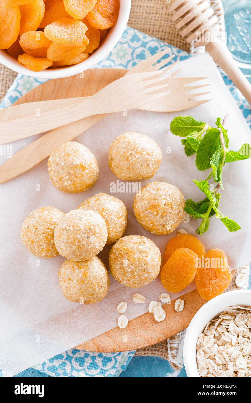 Oat balls with honey, apricot and banana, healthy vegan dessert Stock Photo