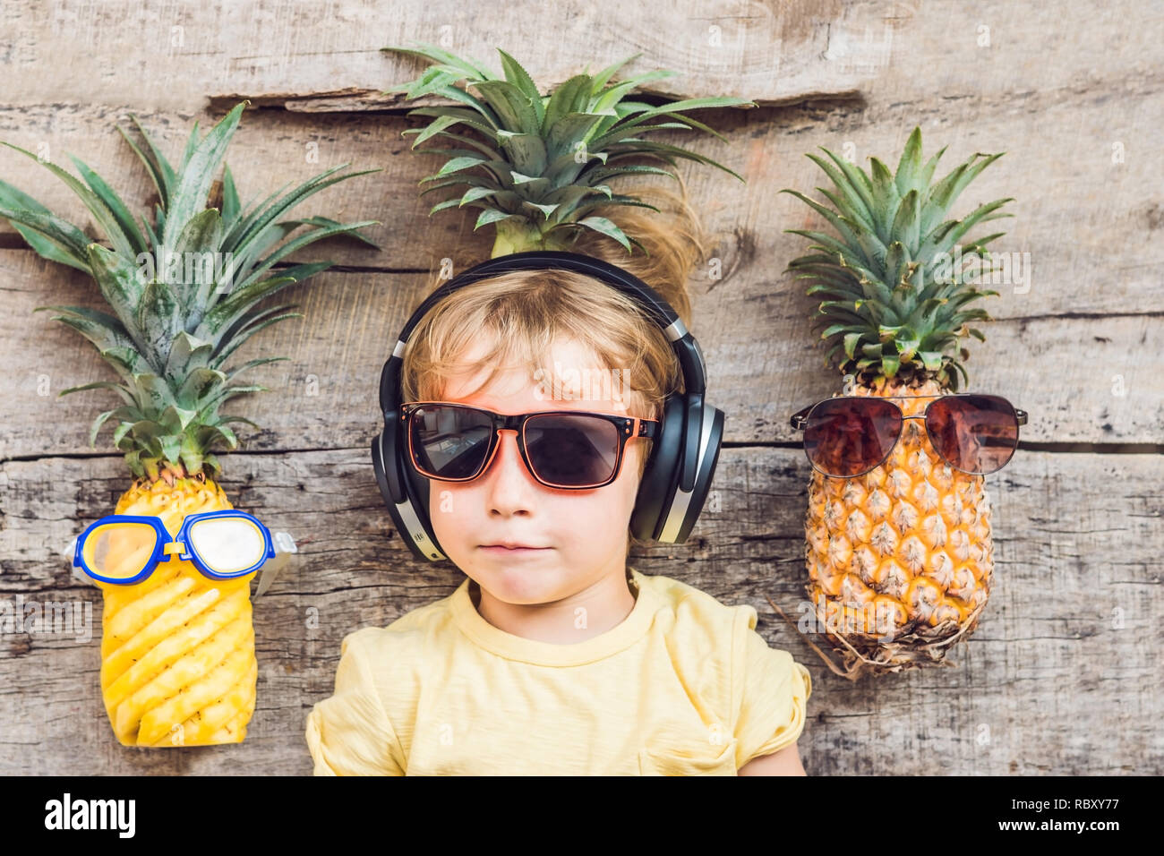A pineapple boy and pineapples on vacation. Stock Photo
