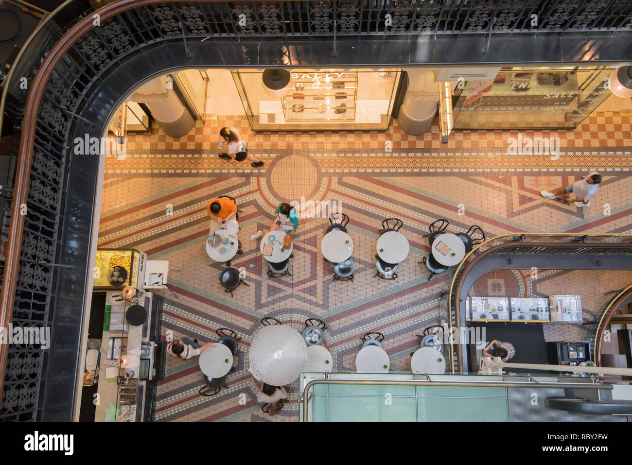Looking down on patrons at a coffee shop inside the Queen Victoria Building, known locally as simply the QVB, in Sydney Australia Stock Photo
