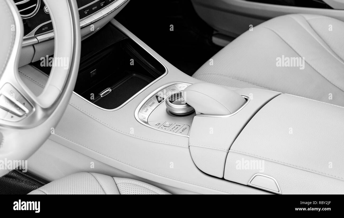 Media and navigation control buttons of a Modern car. Car interior details. White leather interior of the luxury modern car. Modern car interior. Car  Stock Photo