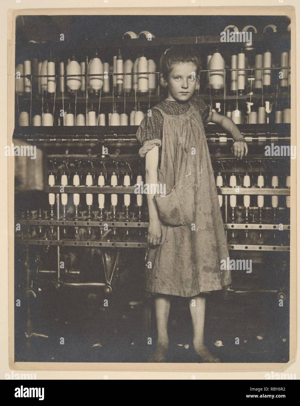 285844 Addie Card, 12 years. Spinner in North Pownal Cotton Mill. Girls in mill say she is ten years. She admitted to me she was twelve; that she started during school vacation and now would ‘stay‘. Location- Vermont Stock Photo