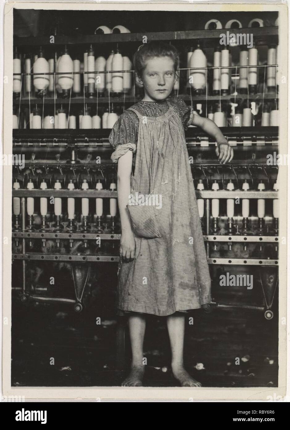 301919 Addie Card, 12 years. Spinner in North Pownal Cotton Mill. Girls in mill say she is ten years. She admitted to me she was twelve; that she started during school vacation and now would ‘stay‘. Location- Vermont Stock Photo