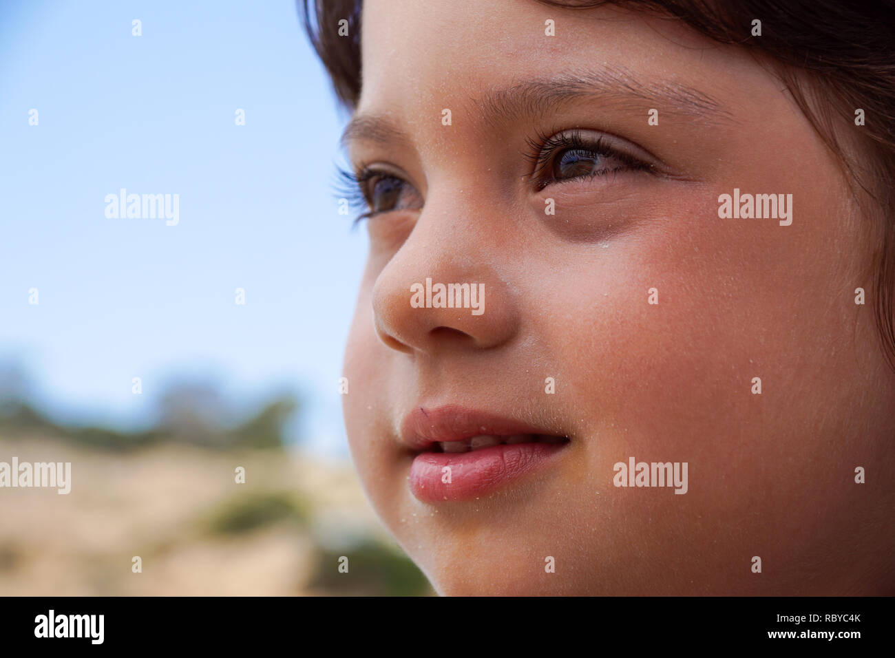 Portrait of adorable smiling little girl child outdoors in summer day Stock Photo