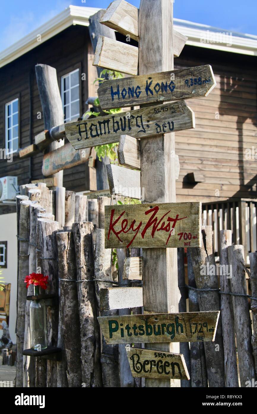 Wooden sign post showing world destinations and directions Stock Photo