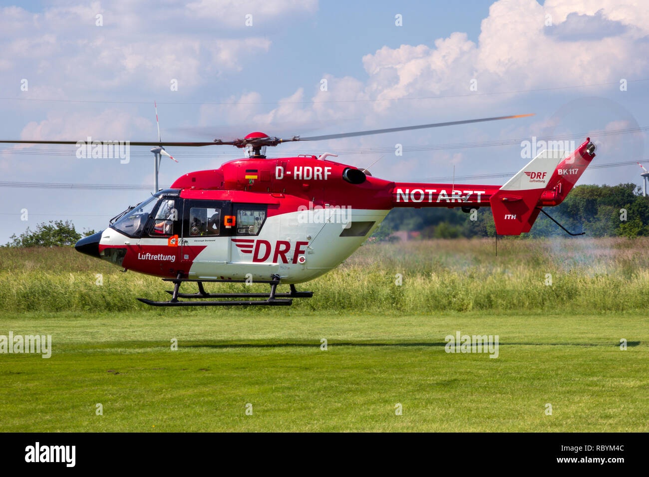 AHLEN GERMANY - JUN 5 2016: DRF Luftrettung (German Air Rescue) BK-117 helicopter landing at Ahlen-Nord heliport Stock Photo