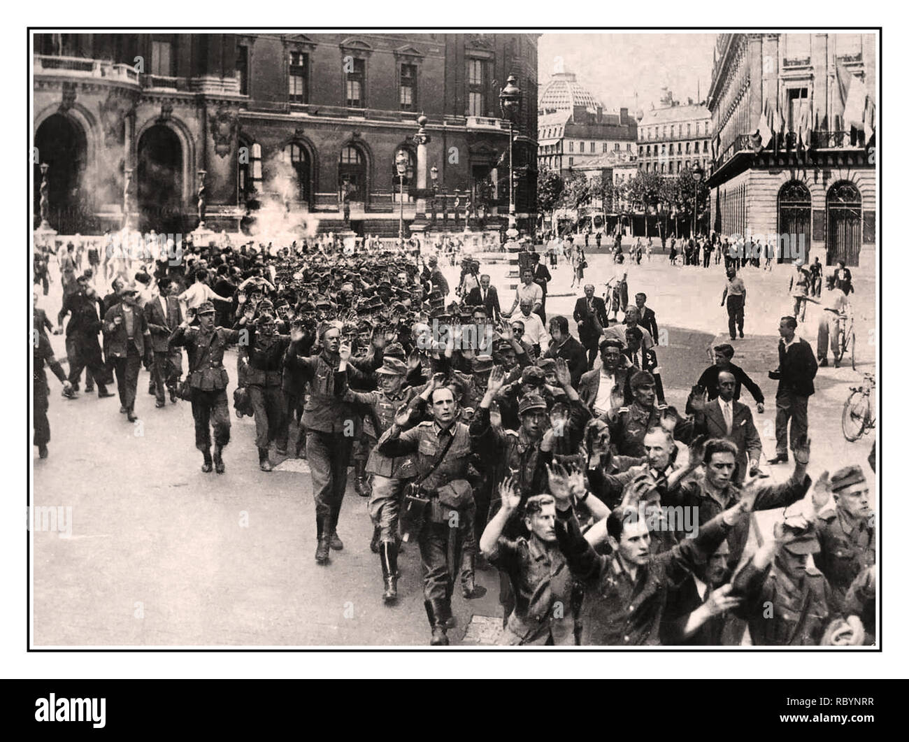 GERMAN ARMY SURRENDER PARIS FRANCE WW2 1945 Paris France  The Allied Liberation of Paris from Nazi Germany Occupation. American Army, liberate Paris.  German Nazi Army Wehrmacht soldiers ignominious surrender with hands held up, with Parisian French crowds jeering opprobrium insults,  many taking their own summary revenge. WORLD WAR II Second World War Stock Photo