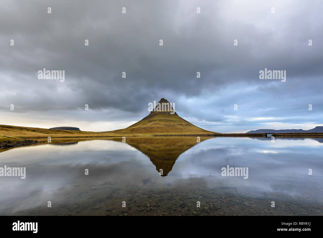 Landscape with Kirkjufell mountain in the background. Amazing mirror