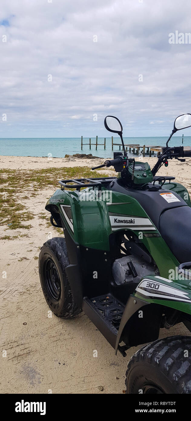 Kawasaki 4x4 on beach in Bahamas Stock Photo