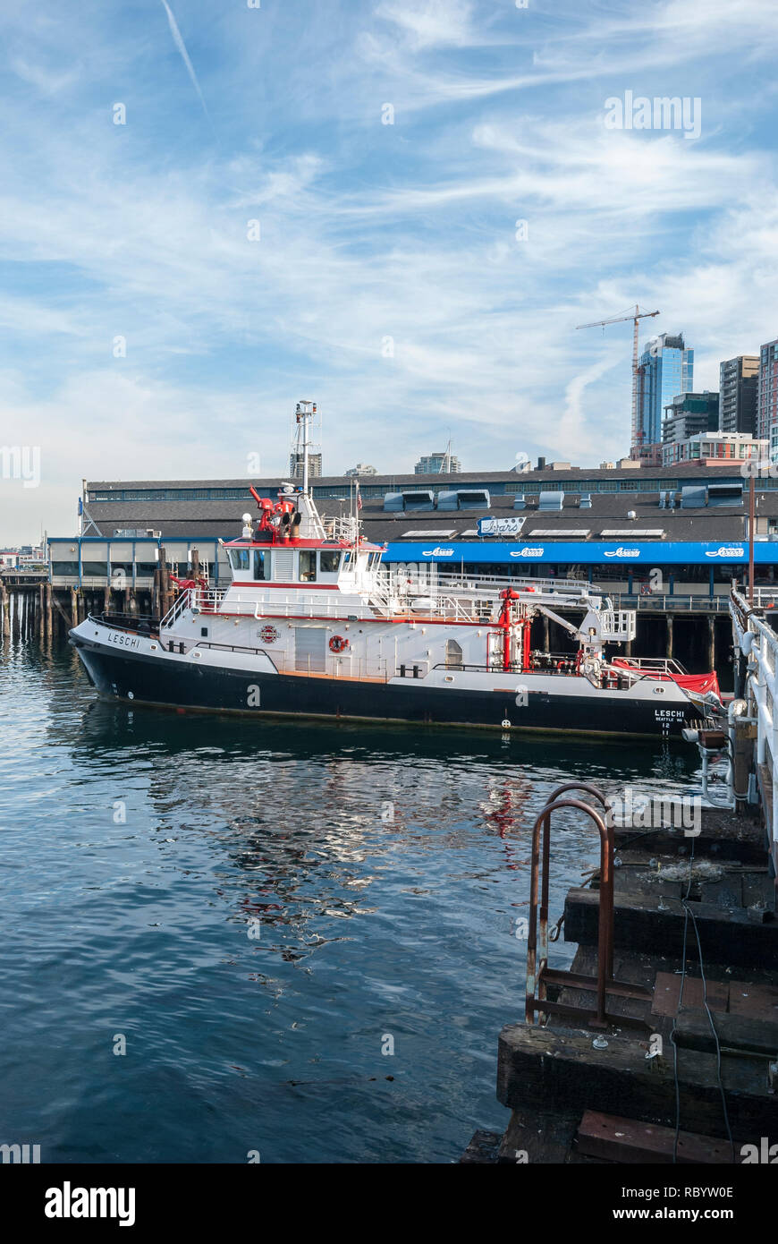 Fireboat Leschi Docked In Front Of Ivar's Restaurant in Seattle Stock Photo