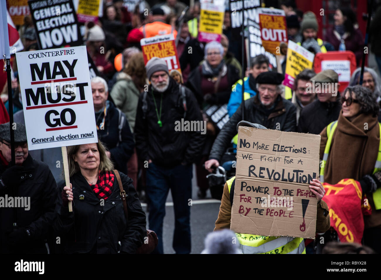 Protesters are seen holding placards during the protest. Thousands rallied in central London for the 'People’s Assembly against Austerity' inspired by the French 'Yellow Vest' protests bringing attention to austerity programs that have hit the poor hard. Stock Photo