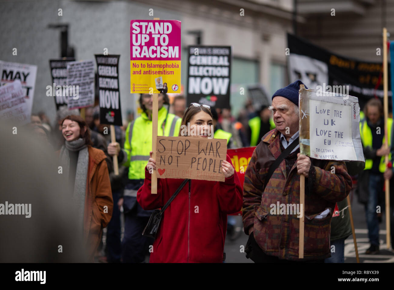 Demonstrators seen with placards at the People's Assembly rally. Thousands rallied in central London for the 'People’s Assembly against Austerity' inspired by the French 'Yellow Vest' protests bringing attention to austerity programs that have hit the poor hard. Stock Photo
