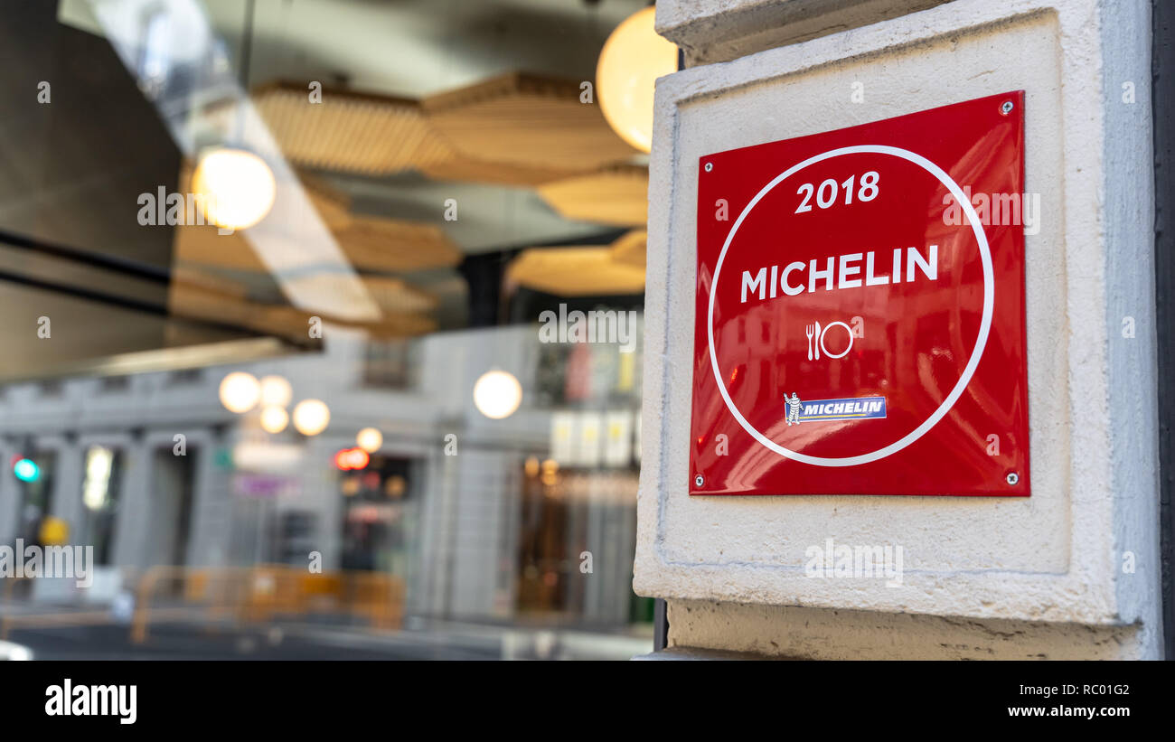 Michelin logo on the restaurant facade in Valencia city center. The MICHELIN Guide's Logo in red. Michelin Red Guide. Stock Photo