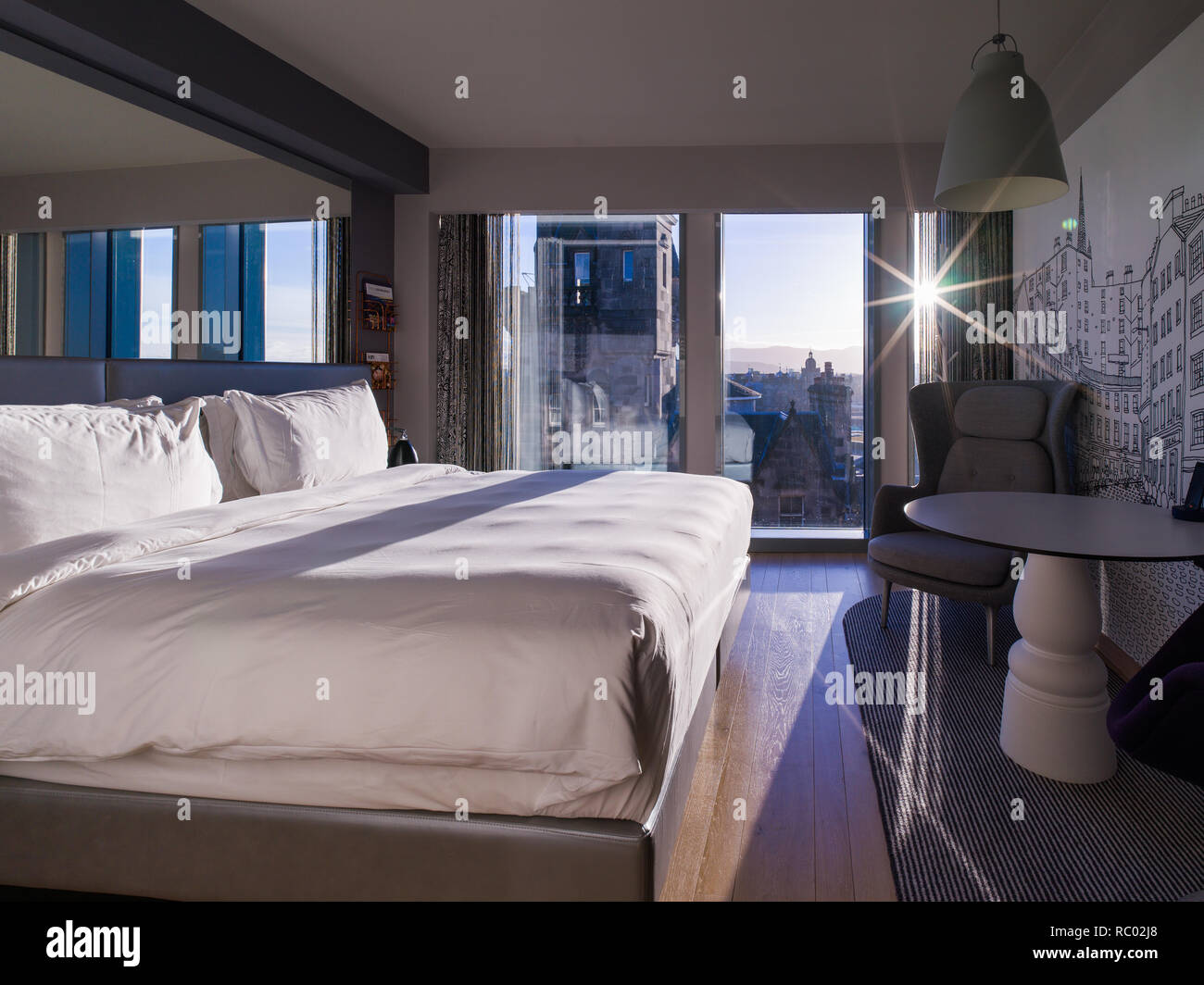 Beautiful bright hotel room with modern design and great views of old