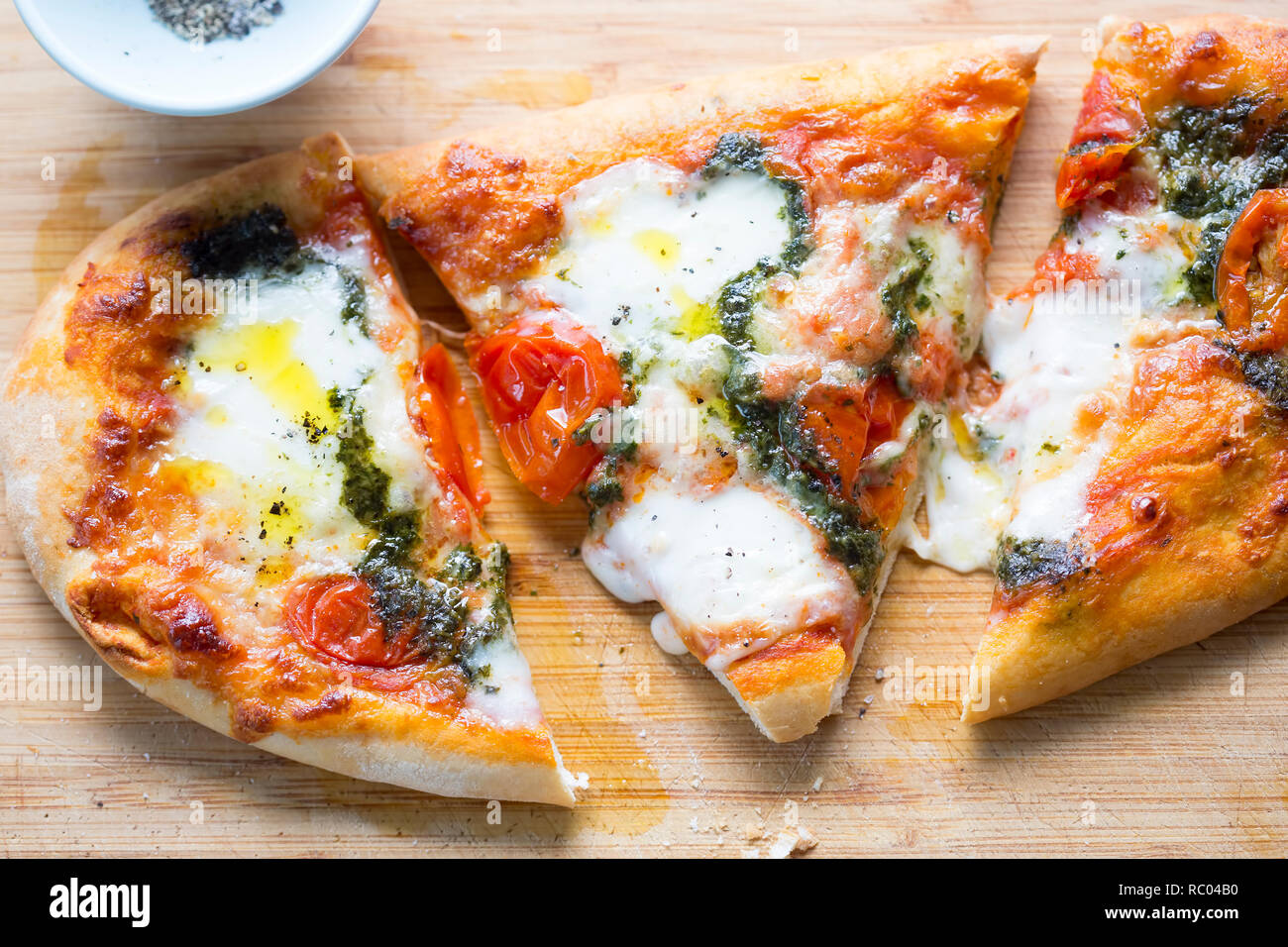 Mozzarella and basil pesto pizza Stock Photo