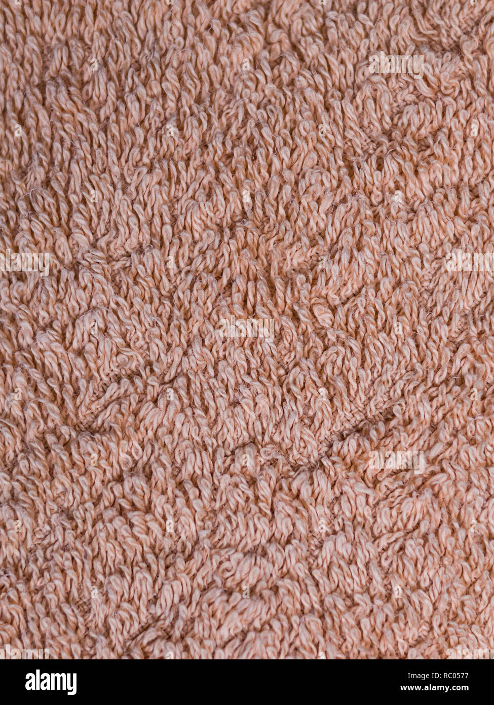 beige fabric terry cloth towel texture. background, bedroom Stock Photo