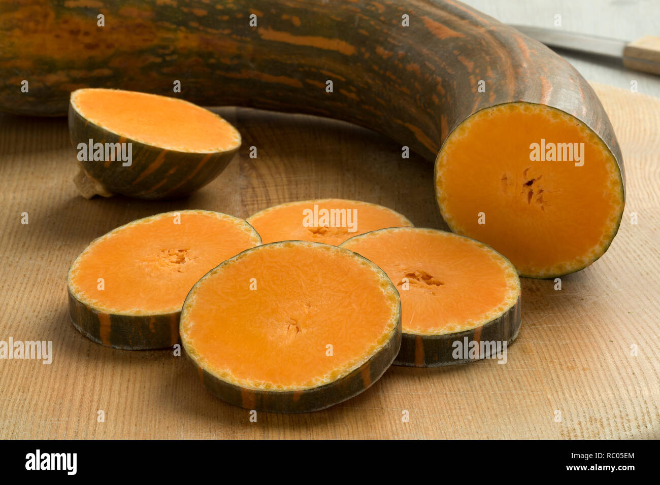 Freah raw Long neck pumpkin and slices close up Stock Photo