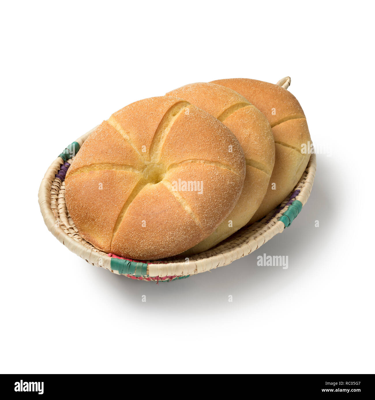 Traditional fresh baked Moroccan semolina bread in a basket isolated on white background Stock Photo