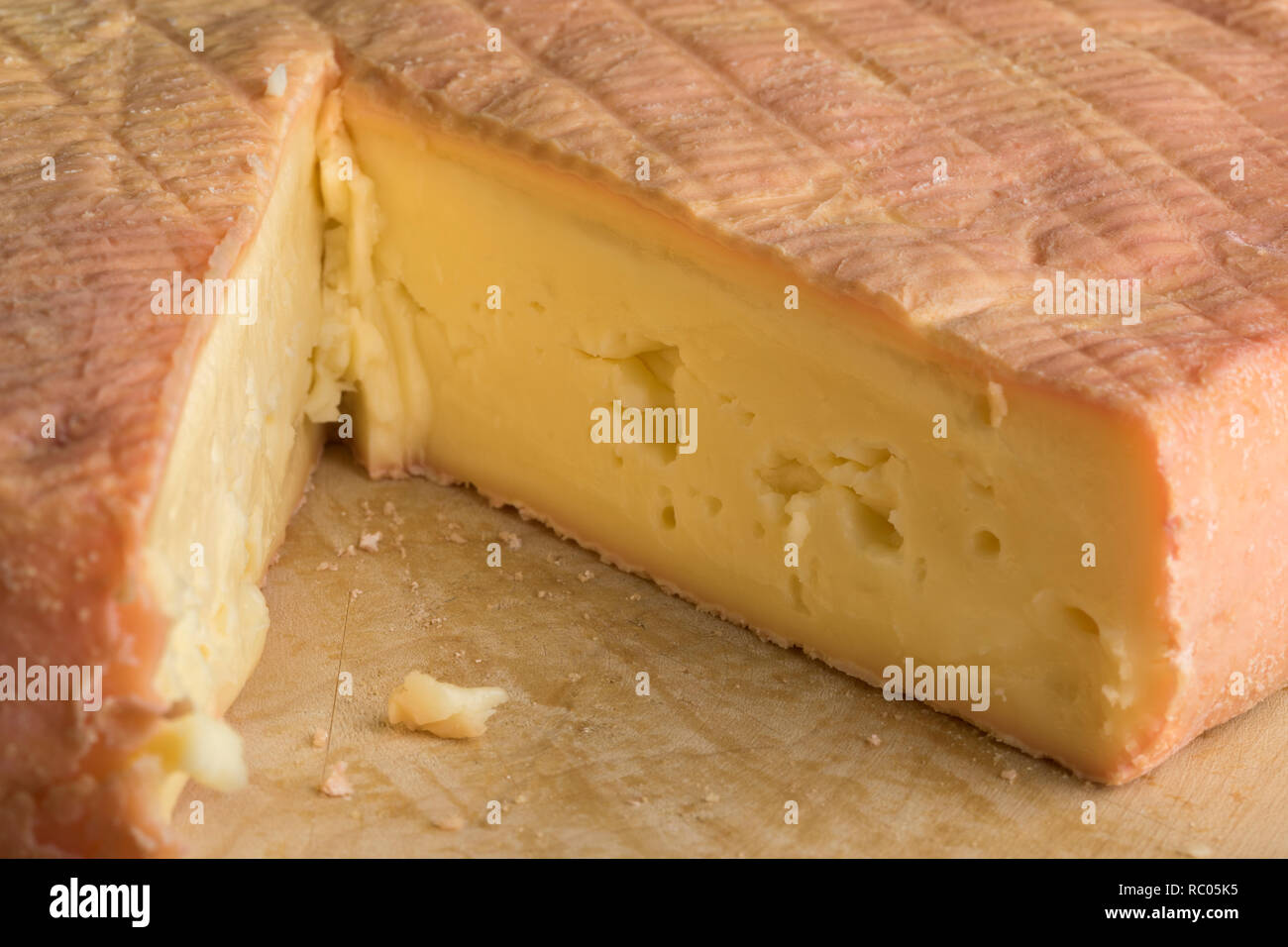 Piece of French creamy delicious Munster cheese closeup Stock Photo